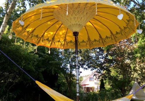 Yellow umbrella with tassels